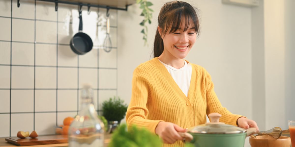 Smiling while Cooking Healthy Meal